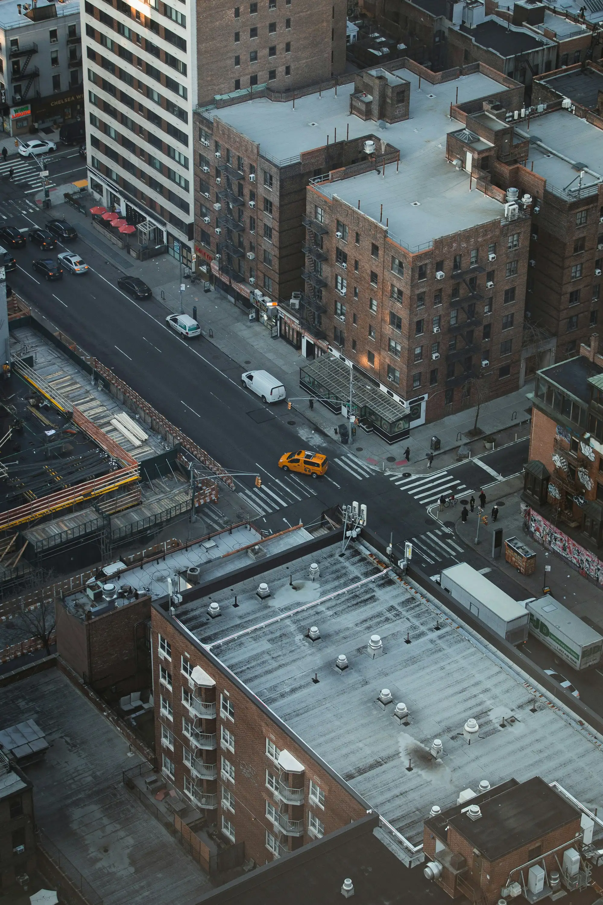 City rooftops and a street, seen from above