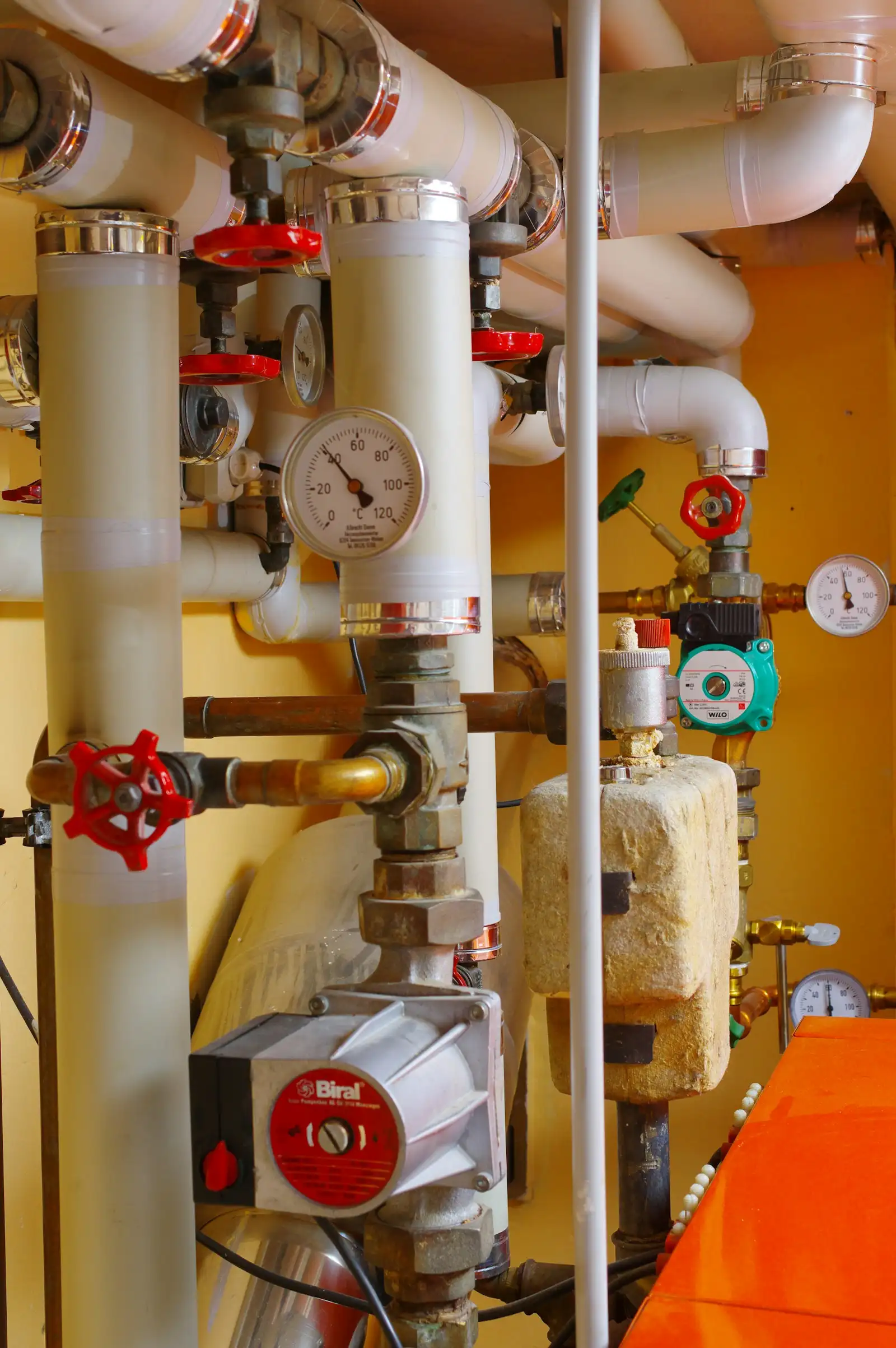 Heating pipes, valves and gauges, close up