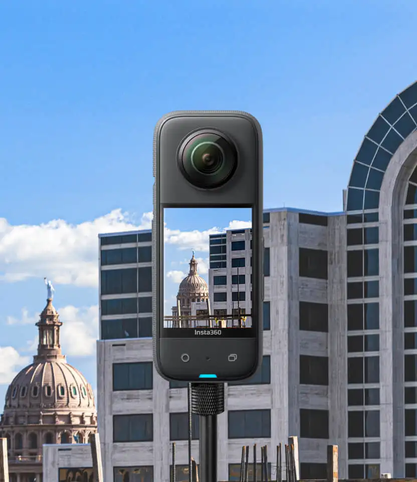 A 360° camera in front of city buildings