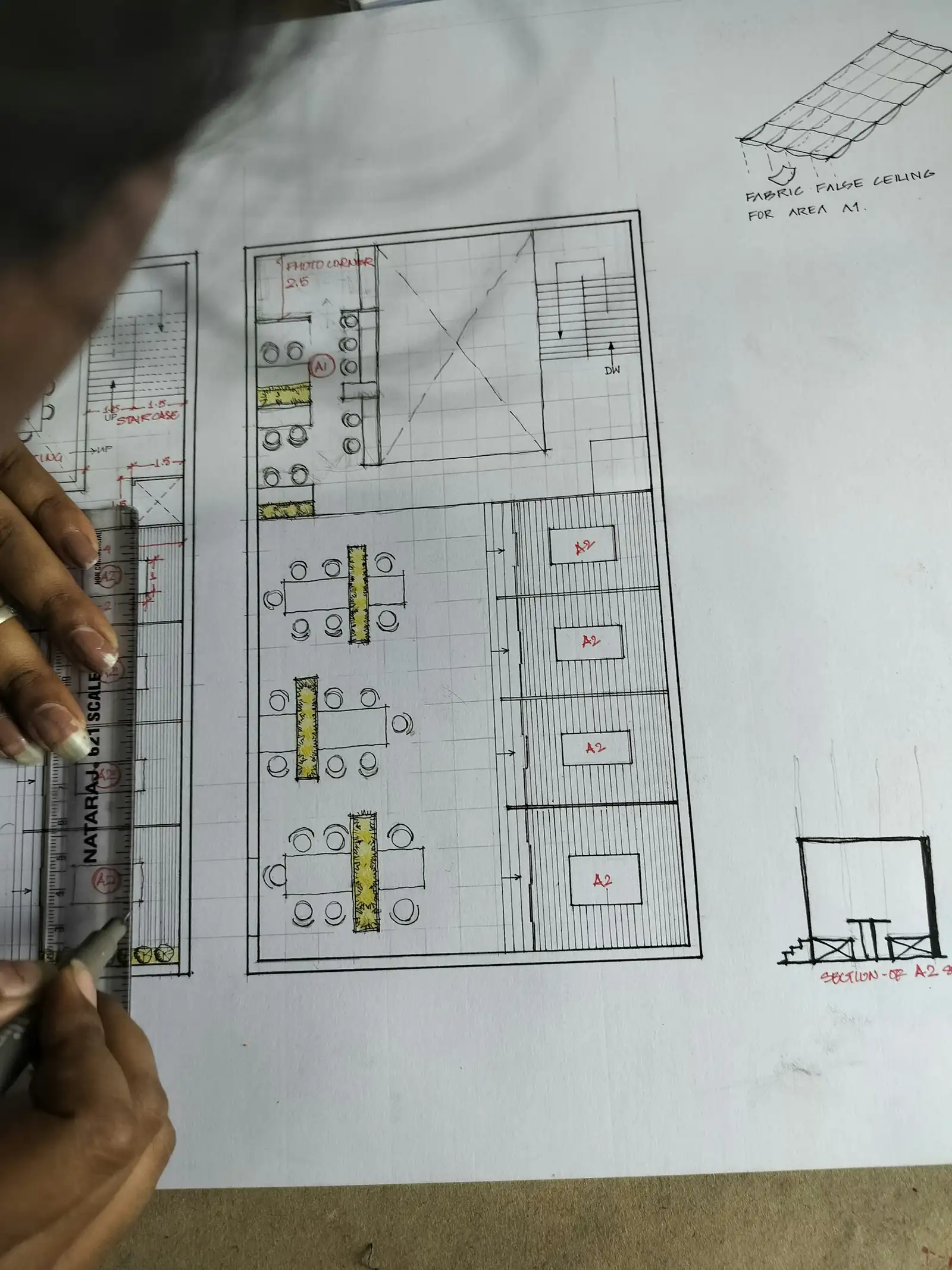 A hand-drawn office floor plan with desks and meeting rooms